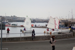 Optimists sailing on the pond